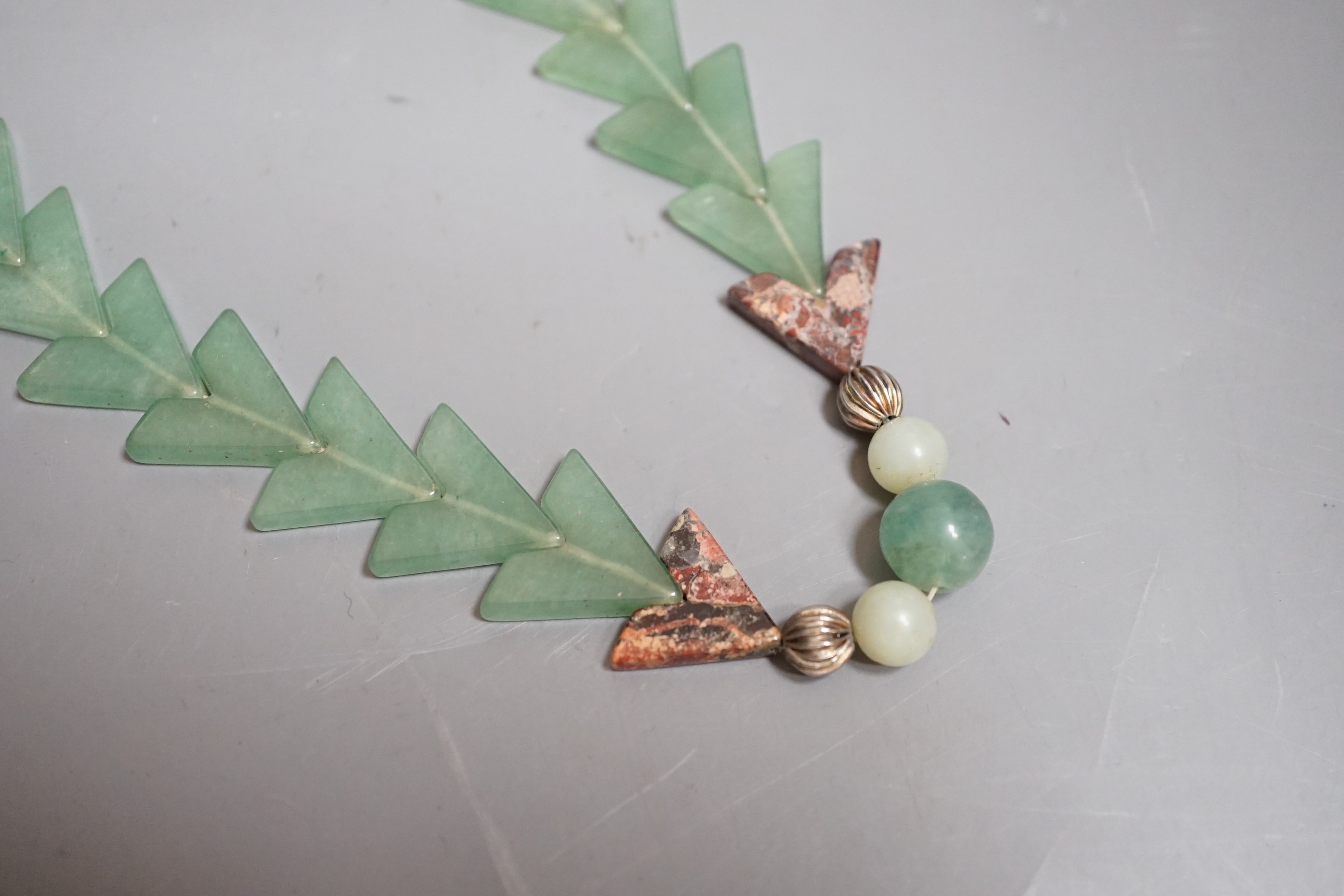 A Chinese jade arrowed pendant necklace